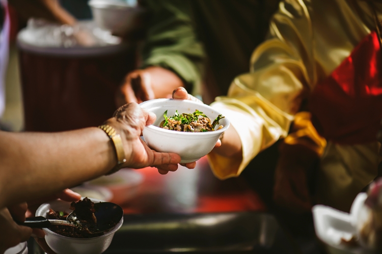 Women into Leadership makes food donation to CHESS Homeless